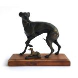 A bronze figure of a whippet, 13.5cmH, on oak base; with one smaller, 4.5cmL