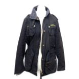 A ladies Barbour black waxed cotton jacket, approx. size 12; together with a Barbour red canvas