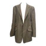 A gent's single breasted tweed jacket, three buttons, single vent to rear, Magee tailored,