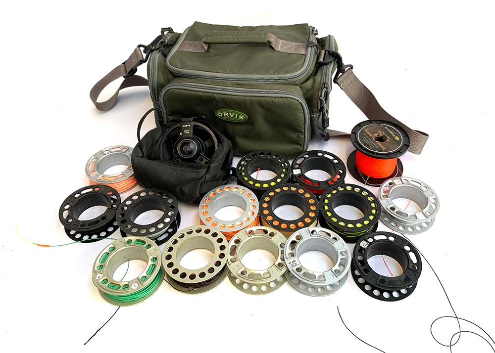 Orvis tackle bag, Greys GRXi #7/8 reel and case, 14 spare spools, various lines and a spool of