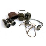 A pair of military issue binoculars in hard leather case; together with military lantern; military