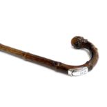 A Swaine & Adeney measuring stick with silver catch