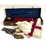 Masonic interest: a brown leather suitcase containing a Toye Kenning & Spencer hooded cloak with