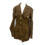 A quantity of military uniforms to include Sam Browne, webbings, pips, radio headset, wool shirts,