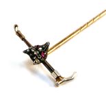 A 9ct gold and white metal tie pin, the terminal in the form of a fox's mask and hunting whip, with