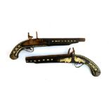 A pair of flintlock pistols, each with bone inlay