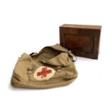 A 1950s military canvas first aid bag and fitted cabinet, 28cmW
