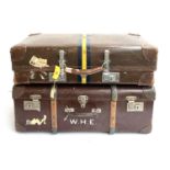 A vintage revelation suitcase with leather corners, the top marked W.H.E, with key; together with