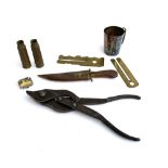 A mixed lot to include E.T.F ltd folding pliers; dagger in wooden sheath; metal cup; shell cases etc