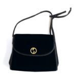 A Gucci black evening bag with Gucci clip case (af)