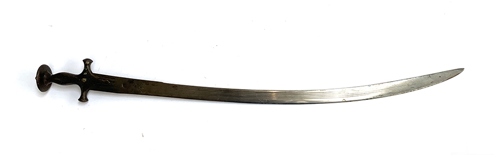 An Indian Talwar sword with curved shamshir 80cm blade, fullered and stamped