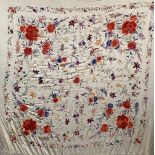 A heavy profusely embroidered 19th century shawl, the central panel approx. 130x130cm, all round