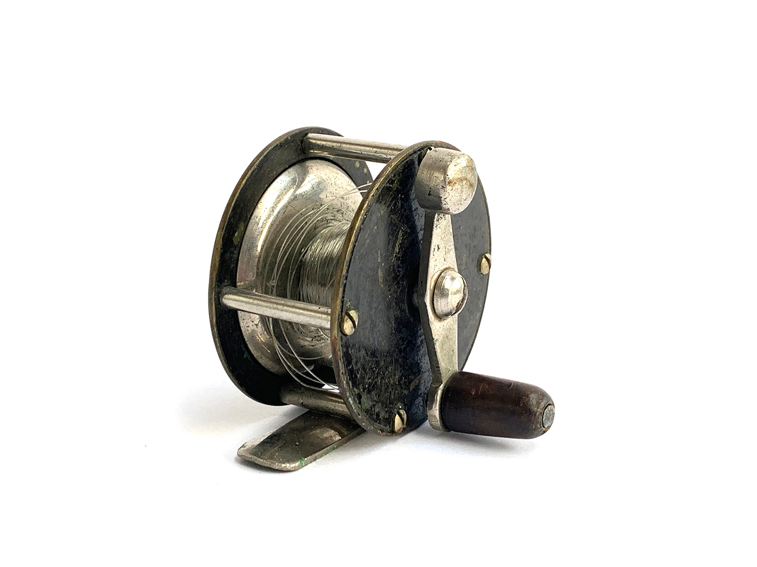 A small nickel fishing reel, 2 1/4 inch drum