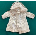 A late 19th century children's cotton embroidered smock, silk embroidered smock top, wool and cotton