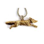 An Asprey 9ct gold running fox, on a .925 silver chain, marked London 1967, approx. 6.9g