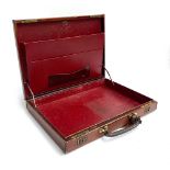 A gent's brown leather writing case, by Swaine, Adeney & Brigg, with fitted red leather interior,