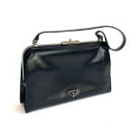 A Prada black leather handbag, with felt dust bag
