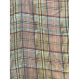 Two unmade curtain lengths of light tartan tweed