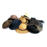 A mixed lot of vintage hats to include lambs wool, straw boaters, panamas, waxed cotton, Harris