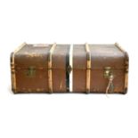 A canvas and wood banded travel trunk with travel stickers and key, Warranted 3 ply, removable tray