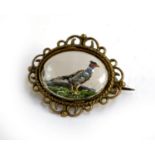An Essex crystal brooch, with reverse carving depicting a pheasant, approx. 3cmW