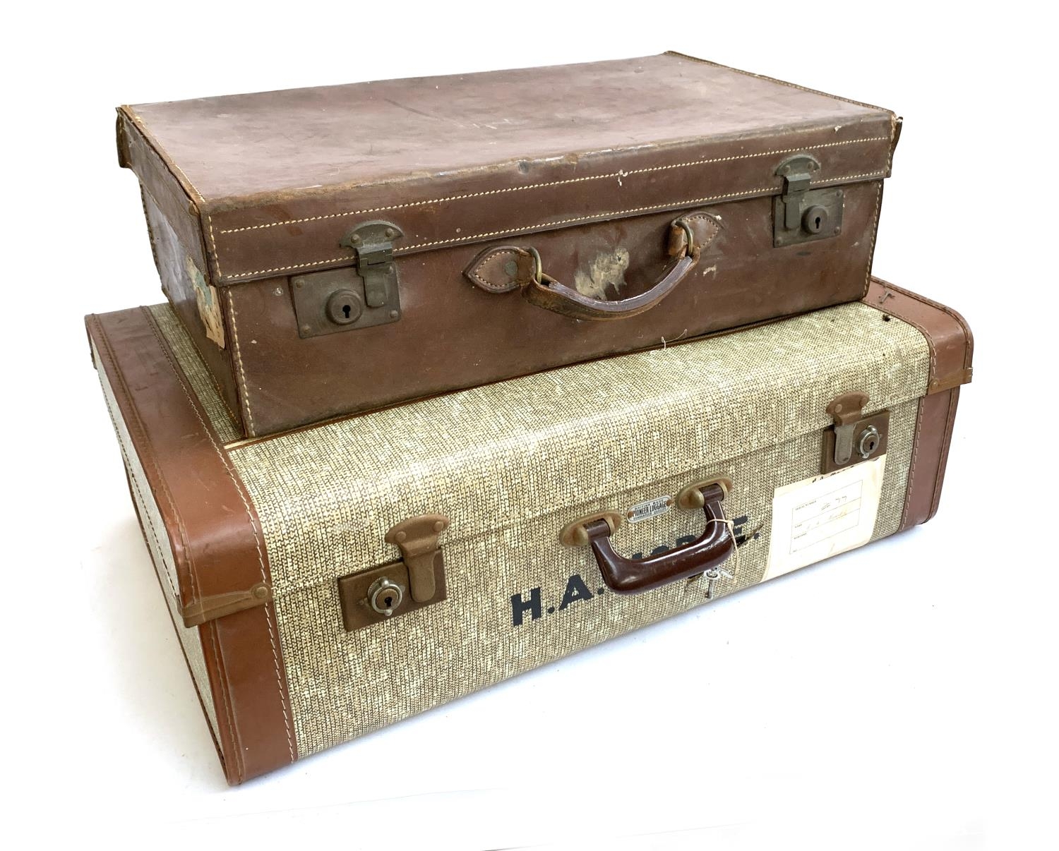 A vintage leather suitcase, the top monogrammed H.M; together with one other canvas and leather