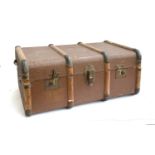 A canvas and wood banded suitcase, 76x49x33