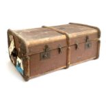 A vintage canvas and bamboo banded travel trunk, withs stickers, top monogrammed H.M, 77x50x33cm