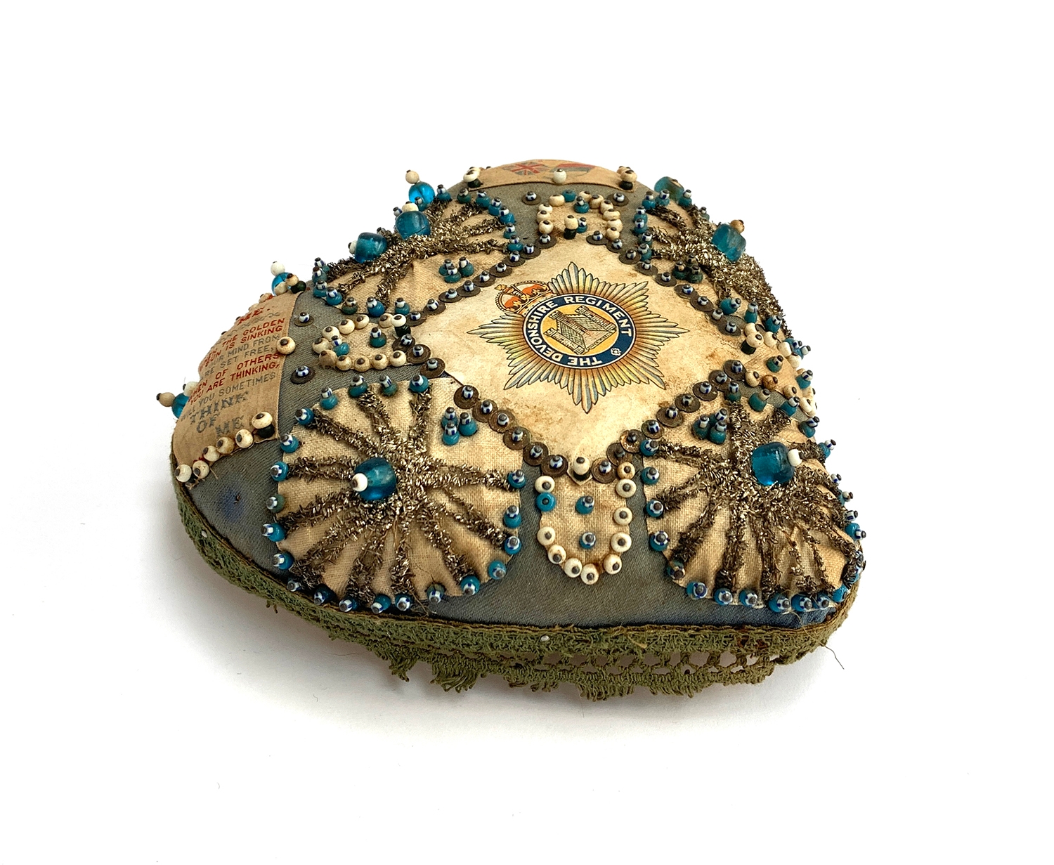 A WW1 beadwork heart shaped pin cushion/sweetheart cushion with regimental crest for The