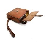 A plated sandwich box, in a fitted hard leather saddle case, 16x16x5cm, flask missing