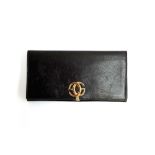 A vintage Gucci dark brown leather ladies wallet, with green leather lining