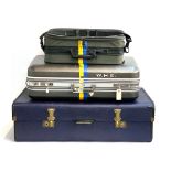An Overpond suitcase, 91cmW; together with two other modern suitcases with blue and yellow painted
