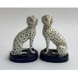 A pair of small Staffordshire dogs, with spot decoration, marks to base, one af, each 12.5cmH