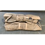 A pair of military issue collapsible canvas beds