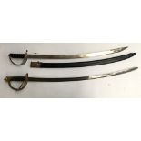 An Indian sabre with brass guard, the blade 80cmL; together with a replica blade with foliate