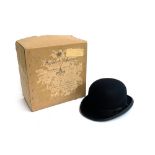 A Lock & Co. hatters black bowler, size 7 1/4, 20.8x16.3cm, together with a Herbert Johnson box