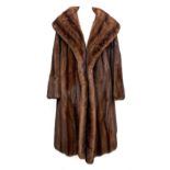 A mink fur coat retailed by Calman Links, London, with shawl collar