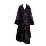 A mink fur coat, size 10, with additional attachment for length