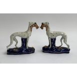 A pair of Staffordshire greyhounds with quarry, spotted decoration, gilt highlight to base, 15cmH