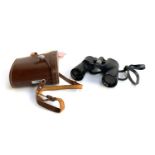 A pair of Swift Saratoga 8x40 binoculars in leather case with racing tags attached