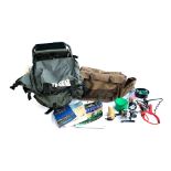 A Wychwood fishing bag containing an Okuma fixed spool reel, Catapult rod rest, various books on