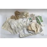 A mixed quantity of damask and other vintage table linen, including a lace christening gown