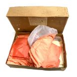 A box of vintage orange and cream silk fabric lengths from Sullivan Woolley & Co., in original box