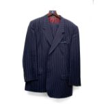 A Burberry's navy wool single breasted suit, chest 44, with two pairs of trousers, on a Burberry's