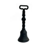 A cast iron doorstop in the form of a bell, 35cm high