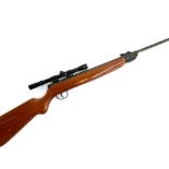 A .22 break action air rifle, with 4x20 NikkoSitling scope, S/N 406506, in faux leather gun slip