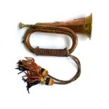 A military copper and brass bugle, bearing the crest of the XII Royal Lancers, and name plate for