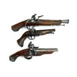 Three replica flintlock pistols, one with double barrel