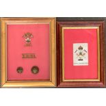 12th Lancers interest, a framed cap badge, buttons and shoulder badge; together with a framed silk