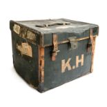An early 20th century canvas and leather suitcase, with travel stickers, 46x36x41cm